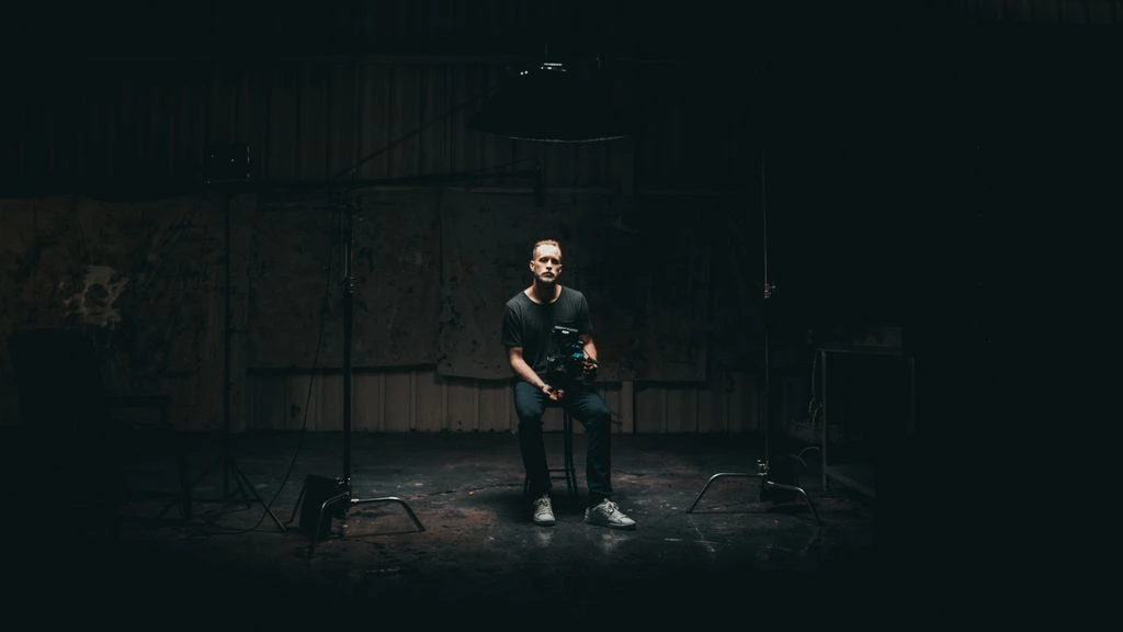 Mateo Duran, founder and director, photographed on the rooftop above the Brooklyn soundstage at golden hour.