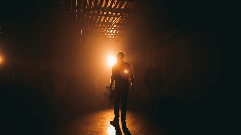 Director silhouetted on the Duran Productions soundstage at golden hour